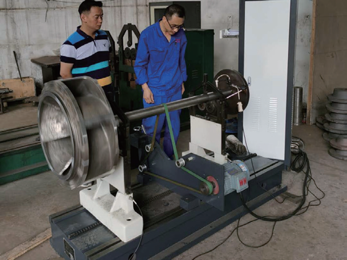 Impeller rotor dynamic balancing machine